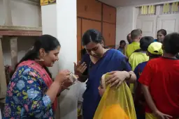 Members of the school community sharing refreshments at a celebration